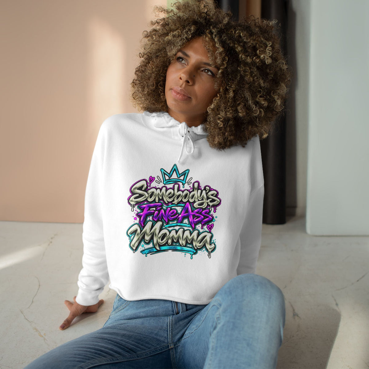 Bold graffiti text artwork on cropped hoodie