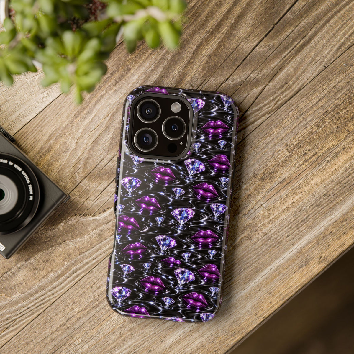 Glossy-looking gem and purple lips design printed on a phone case.
