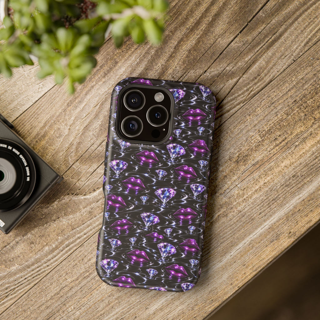 Graphic phone case with bold purple lips and jewel accents.