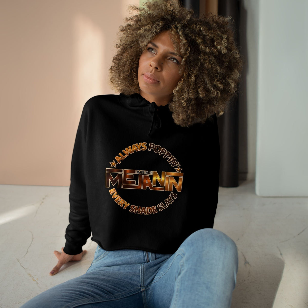 Bold text graphic on an Always Poppin' Melanin pullover crop hoodie.