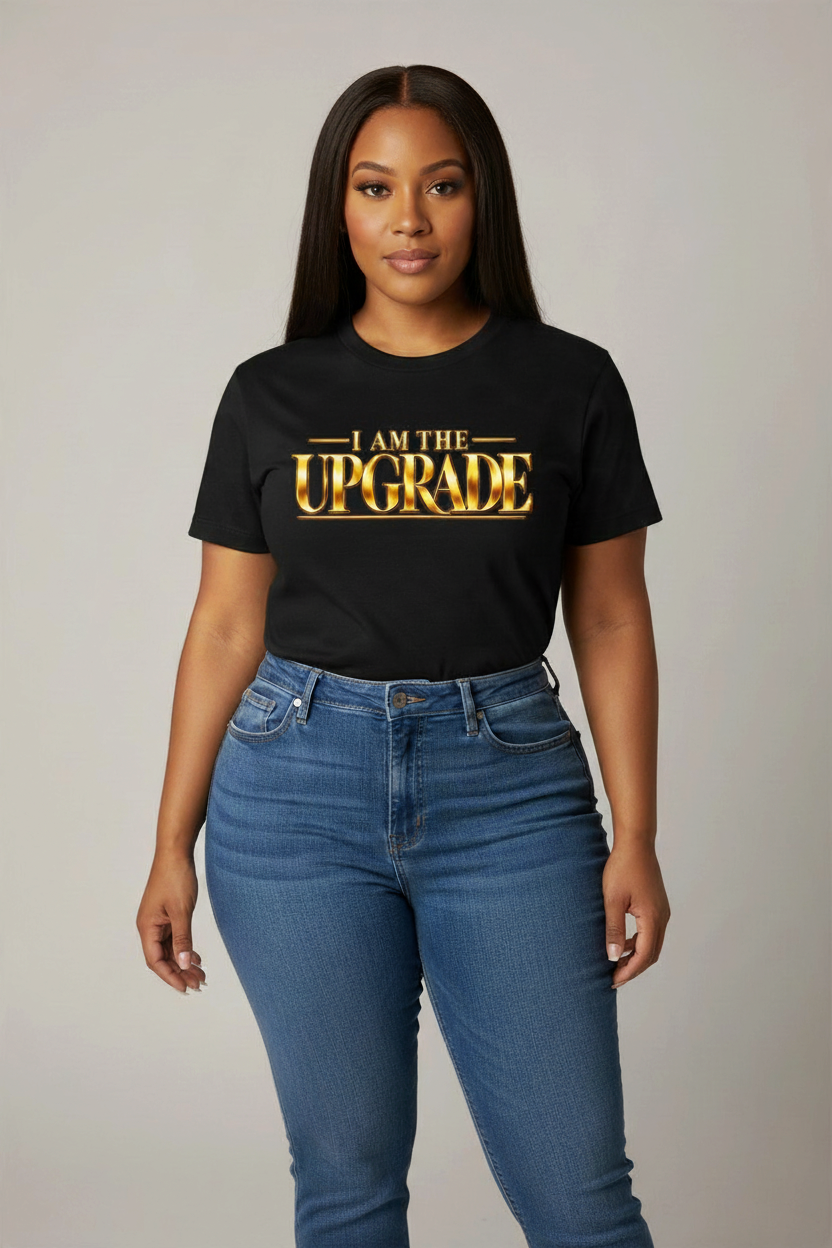 I Am The Upgrade statement T-shirt with bold gold-toned graphic lettering.