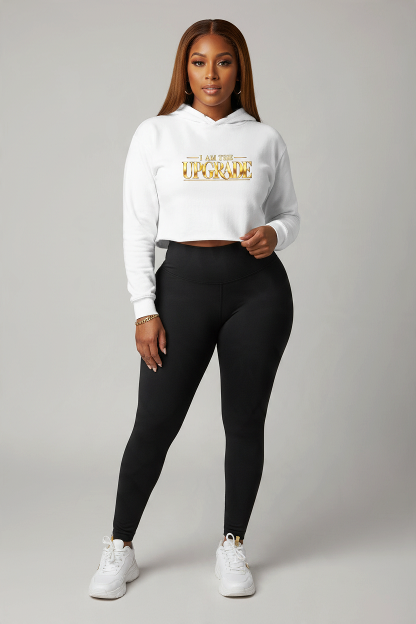 Featured I AM THE UPGRADE cropped hoodie with gold statement design.