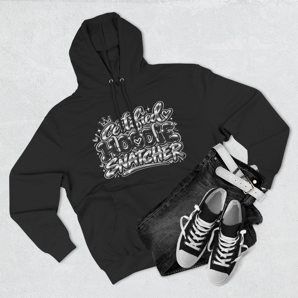 Throw it in the Bag black fleece hoodie with Certified Hoodie Snatcher graphic, styled with jeans and sneakers.
