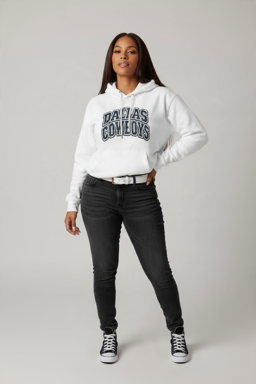 Throw it in the Bag Dallas Cowboys white fleece hoodie with vintage script graphic worn by a woman in black jeans.