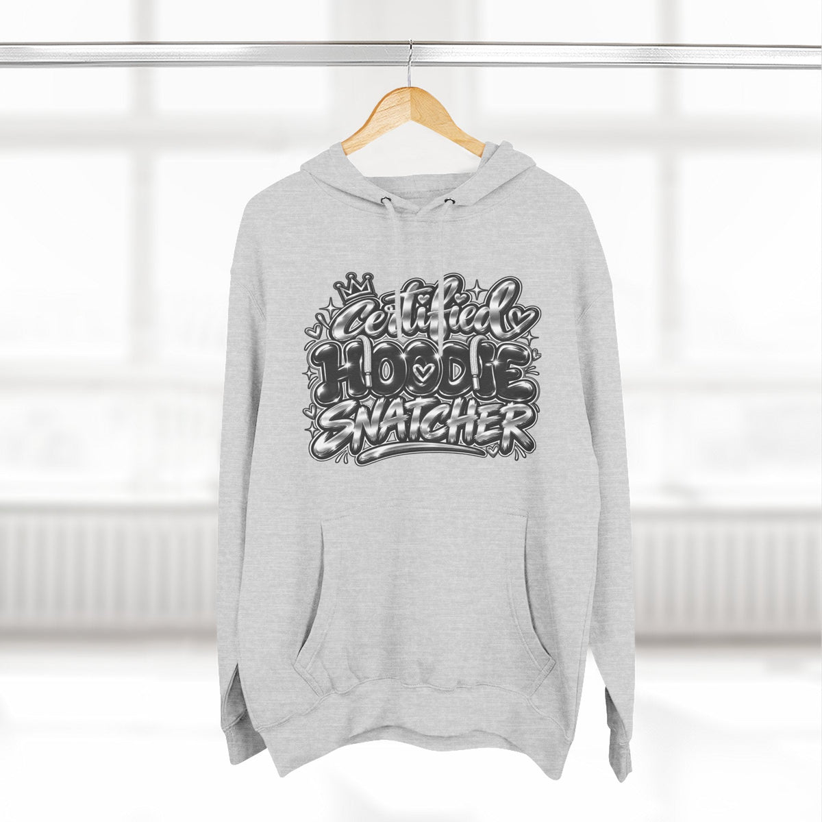 Throw it in the Bag grey fleece hoodie with Certified Hoodie Snatcher graffiti graphic print on a wooden hanger