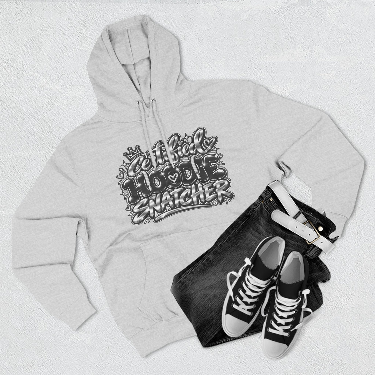 Throw it in the Bag grey fleece hoodie with Certified Hoodie Snatcher graphic, styled with black jeans and sneakers.